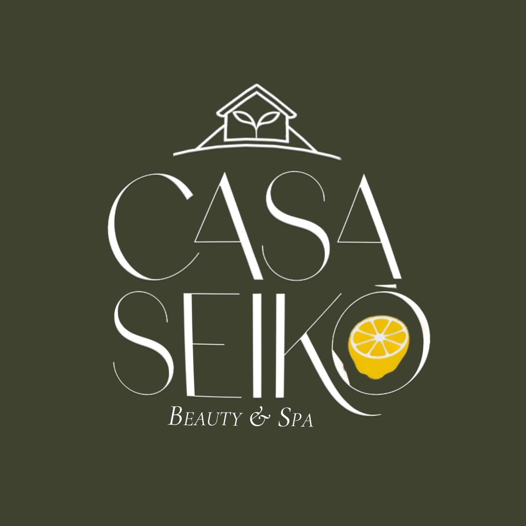 Logo Casa Seikô Beauty & Spa com uma casa, uma folha e um limão
